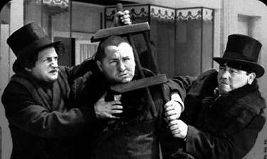 060526 three-stooges-curly-in-a-vice scaled.jpg